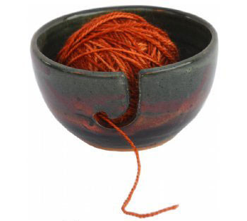 A <a href="http://www.amazon.com/Yarn-Bowl-in-Moonscape-Glaze/dp/B00NEX6HCA/?_encoding=UTF8&amp;tag=vira0d-20" target="_blank">yarn bowl</a> is perfect for a knitter, especially if they're always getting tangled!