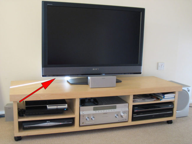 The USB port on the back of most TVs can be used to charge your phone if you're traveling.