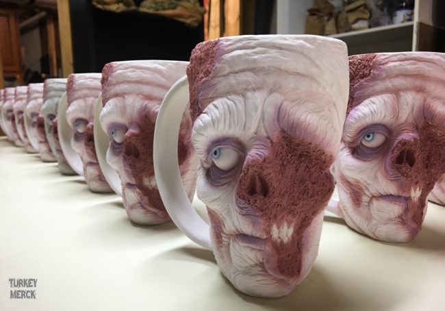 Once he sculpts each stoneware mug, he adds delicate layers of gory glaze to achieve an effect that has me fully convinced that zombies actually exist and that we should be very, very afraid.