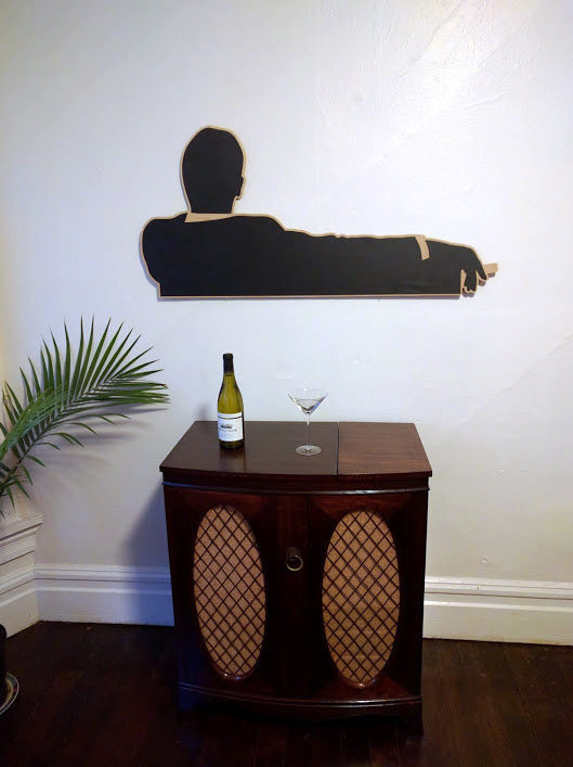 Complete with a Don Draper wood cutout, this DIY project is certainly a rousing success!