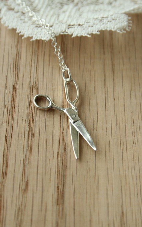 These tiny scissors won't be very useful for crafts, but they <a href="https://www.etsy.com/listing/100970373/the-sterling-silver-scissors-necklace" target="_blank">sure are adorable</a>. 