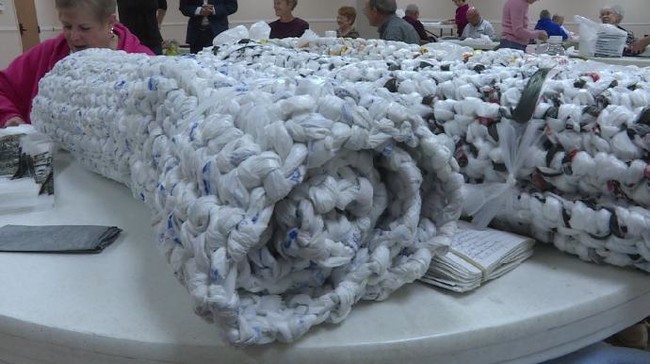 Each week, they crochet thousands of bags into durable sleeping mats for the shelters in their area.