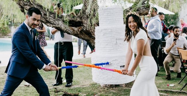 Clayton Lee and Karen Chan contacted a custom pinata company. The couple gave them a picture of the cake they would have chosen and had them create a pinata of the three-tiered sweet.