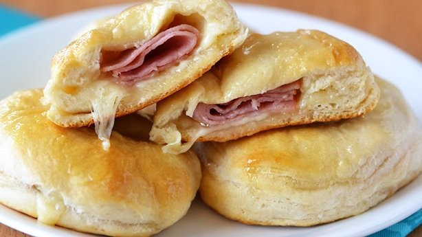 Take <a href="http://www.pillsbury.com/recipes/stuffed-honey-ham-biscuits/0945f4ae-8552-4065-9b49-cd49aa3c7ac0" target="_blank">ham and cheese</a> to a whole new level. 