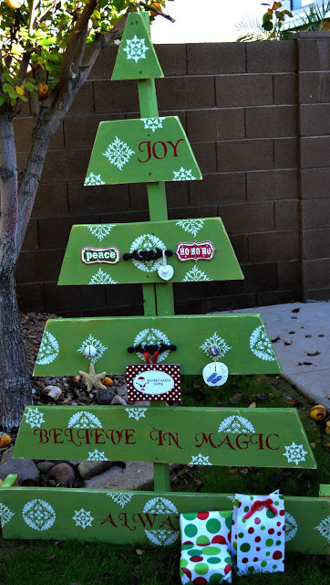 If you're not content with a simple coat of paint, <a href="http://crissyscrafts.blogspot.com/2011/12/pallet-christmas-tree.html" target="_blank">cut your pallet</a> into the shape of a tree.