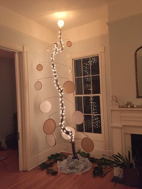 Use a branch to make <a href="http://www.instructables.com/id/Alternative-Christmas-Tree-2015/" target="_blank">a tree of epic proportions</a>.