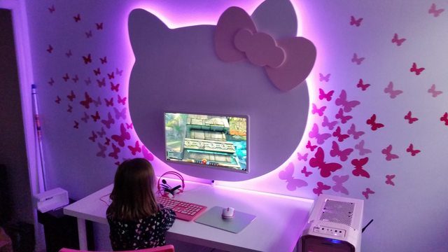 After all of the paint was dry, Dad added some neon LED lights behind the wooden shapes and attached them to the wall behind each computer.