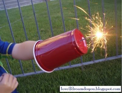 Protect your kids' hands (and your own) from sparklers with disposable cups.