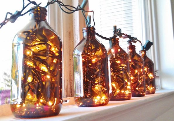 For a fun way to use string lights year-round, stuff 'em in a bunch of bottles.