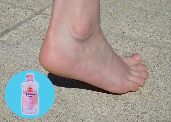 Rub baby oil onto cracked heels daily and your feet will feel so smooth in just a few days.