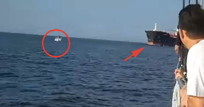 This Tiny Boat Came Within Inches Of Being Crushed By A Huge Container ...