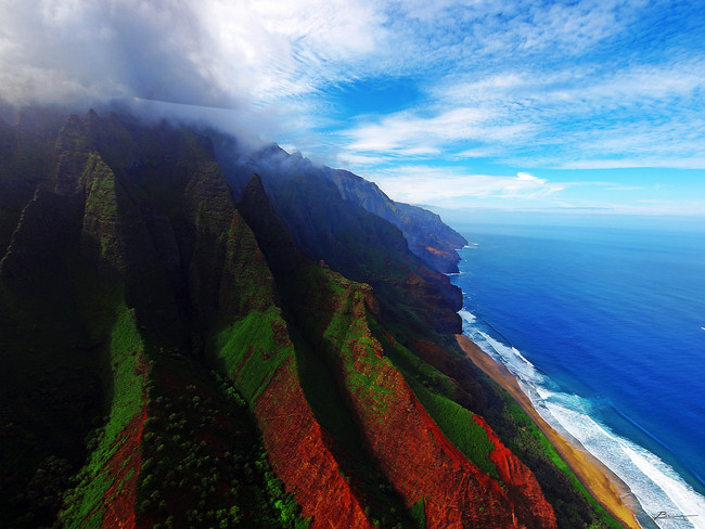 Do a flyover of Kauai's coastline.