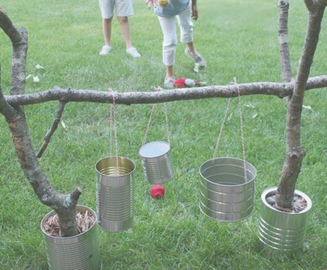 A simple game of <a href="http://www.inhabitots.com/10-super-fun-diy-outdoor-games/diy-yard-games-tin-can-toss/" target="_blank">tin can toss</a> will keep your tots occupied for an afternoon.