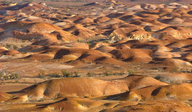 People can't live at surface level in Coober Pedy because temperatures are way too high.