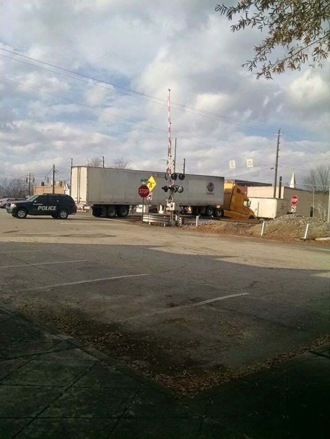 This is a railroad crossing in Georgia. The signage around the area is a little confusing, and trucks regularly end up getting stuck on these train tracks.