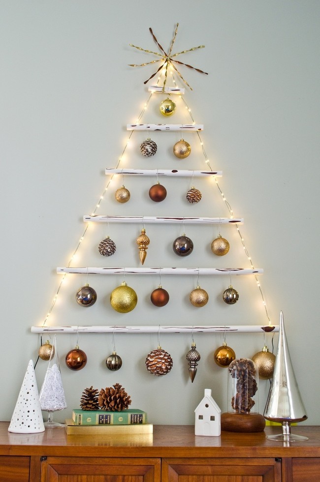 This <a href="http://www.curbly.com/users/alicia/posts/16649-how-to-make-a-faux-wood-hanging-christmas-tree-a-giveaway" target="_blank">hanging tree</a> is probably the coolest of all.
