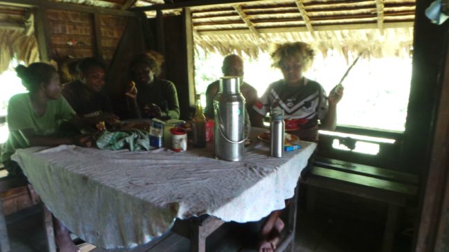 This is the kitchen table that everyone eats around. It's small and cramped, but they make it work. For breakfast, they usually eat biscuits and drink tea.