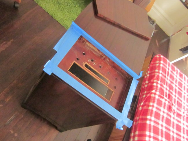 Next, he took the drawer on top and gave it a new bottom, covering it in red felt.