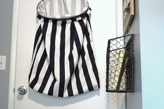 Suspend your laundry basket on a door to save floor space.