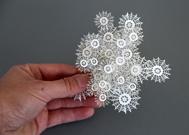 He makes hundreds of these intricate paper cuttings for every single piece.