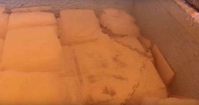 Bauge now pays a man in town to refill the dry ice in his grandfather's shed once every two weeks. Pictured below is the inside of the freezer that Morstoel's body is stored in.