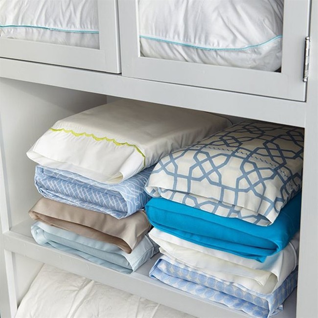 Put matching sheet sets into pillow cases. It'll save space and annoyance!