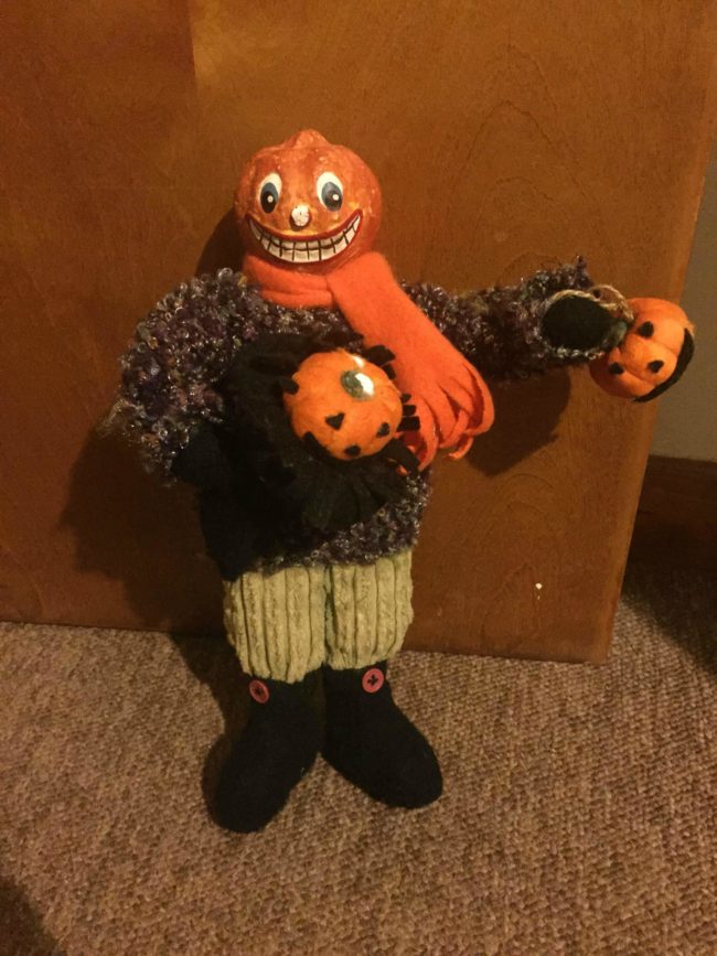 Wait, if he's a pumpkin man, is he holding the disembodied heads of his kin?