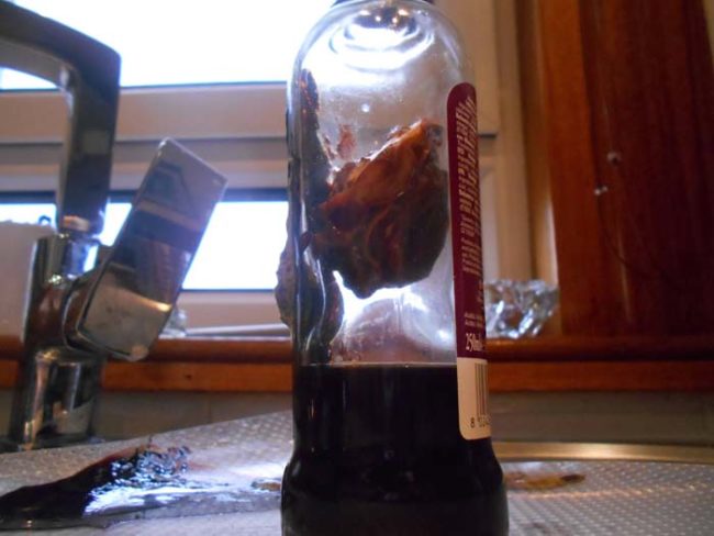 It turns out that Hassassin30 had stored this bottle of vinegar in a warm, dark place, which caused the substance to "mother."