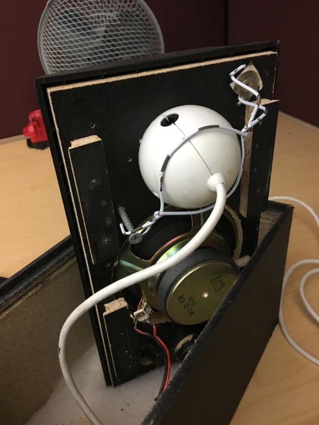 After removing the back, he found this. That white thing is not a speaker -- it's actually a webcam. Someone created this unique spy speaker with bad intentions.