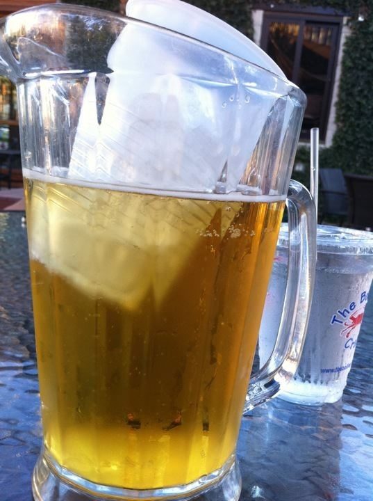 Keep beer cool by freezing water in a plastic cup.