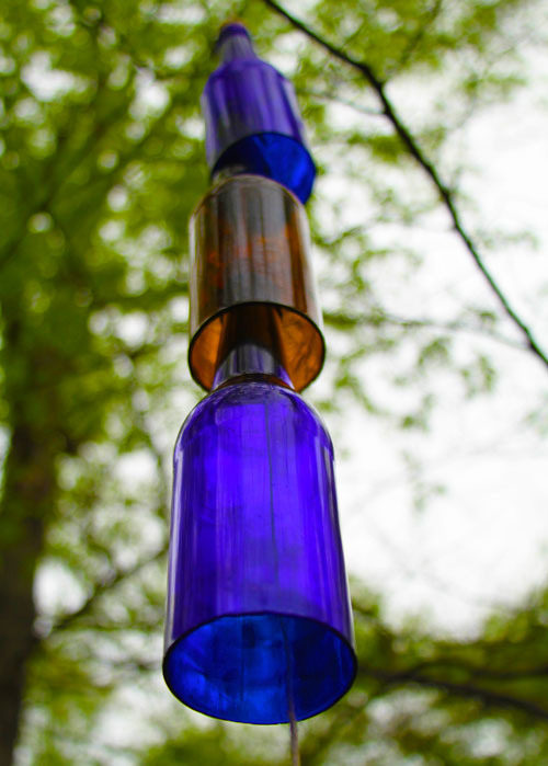 Enjoy the soft sounds of <a href="https://nouveaubohemian.wordpress.com/2012/03/22/inspired-design-daily-diy-beer-bottle-wind-chime/" target="_blank">beer bottle wind chimes</a>.