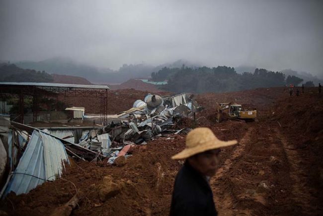The cause of the landslide was a gigantic mound of mud and construction debris that was being stored at an industrial park in the city.