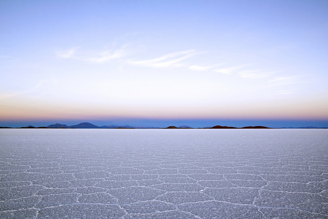 Witness a sunrise in Bolivia's Salar de Uyuni.