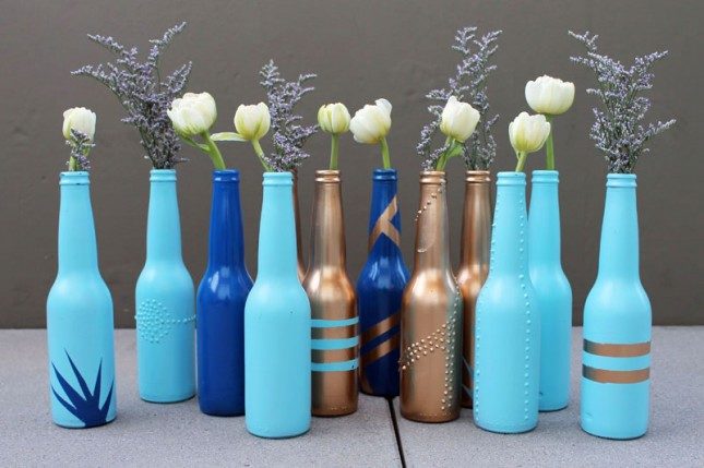 A little spray paint is all you need to make your bottles into vases.