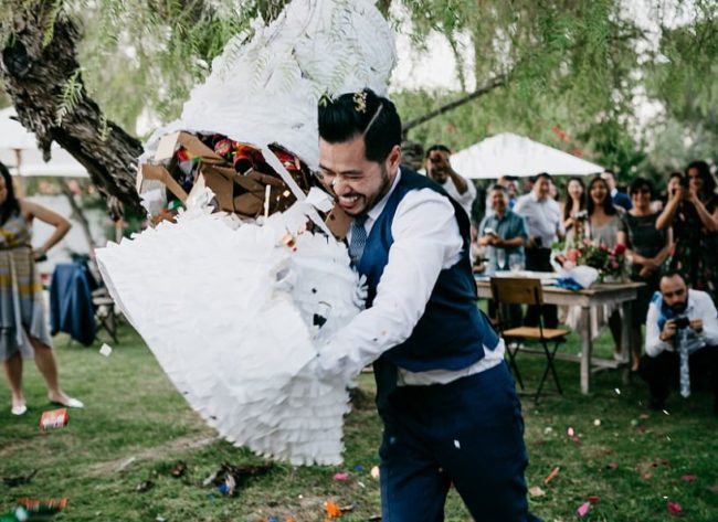 That said, the pinata was a little <em>too</em> strong. Lee had to give it a bear hug to spill all the goodies.